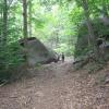Hiker walking between two massive rocks at Saxon Woods -  Photo: Jane Daniels